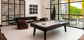 Pool table in front of a large window