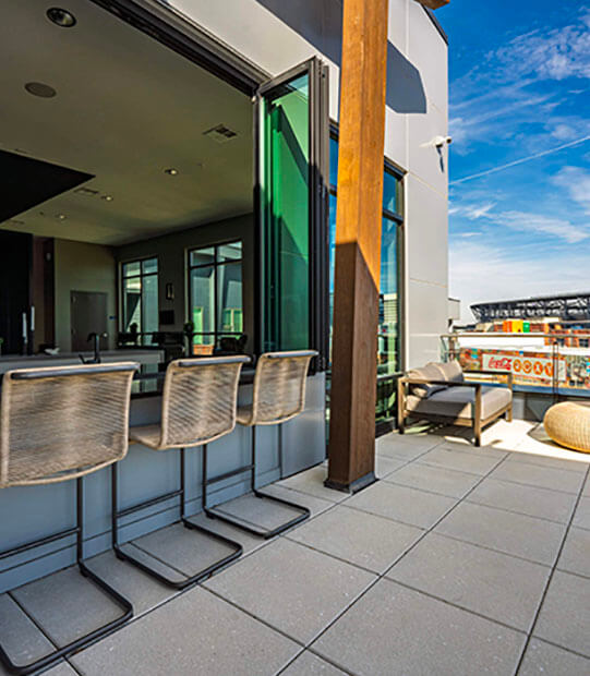 Top floor patio with bar seating area and retractable nanna windows