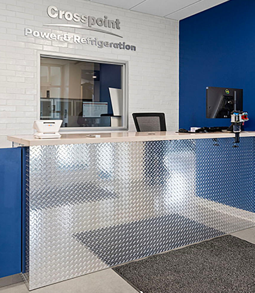 Reception desk with white tile and cross-hatch steel accent